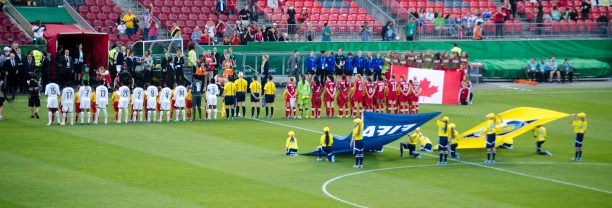 Both teams shaking hands withe the officials and referees 