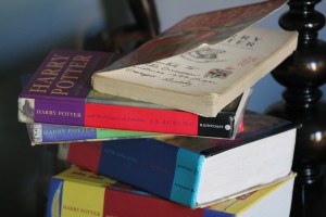 My stack of Harry Potter books, with an inscription that has since become priceless.