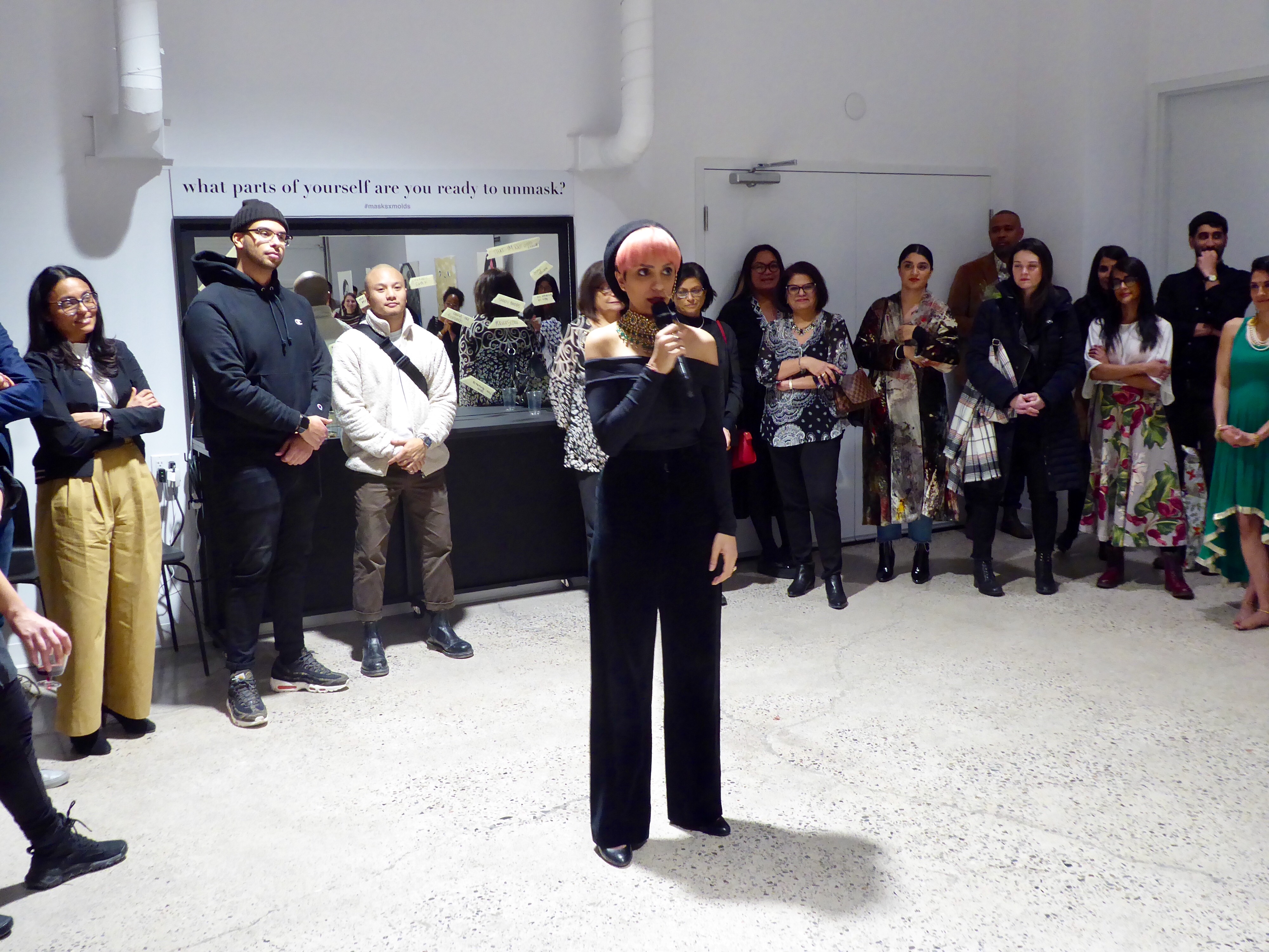 Romana Kassam presents at MasksxMolds, her first solo exhibition in Toronto. Photo by: Rejana Hirjee.